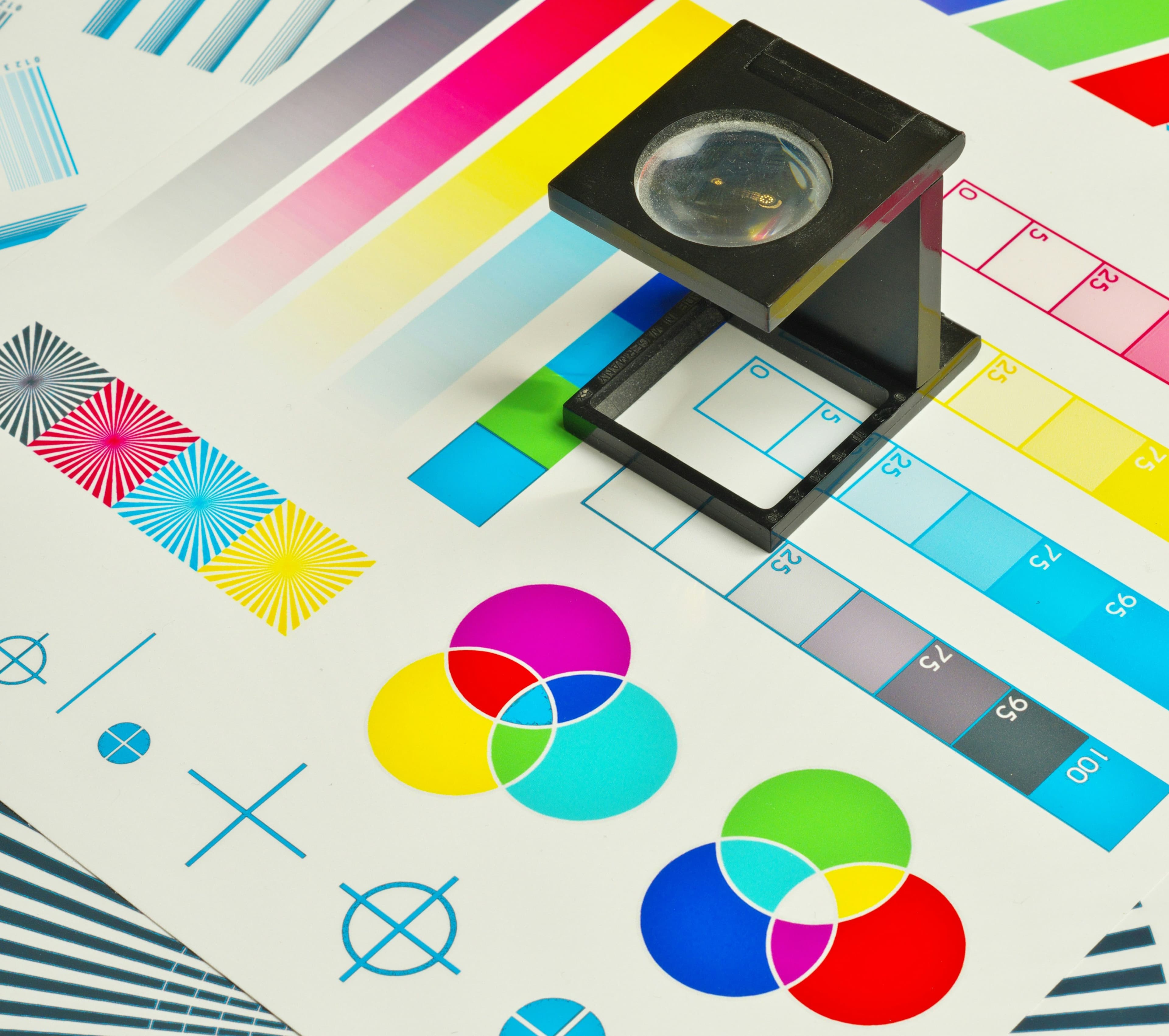 Print color calibration sheet examined under a loupe
